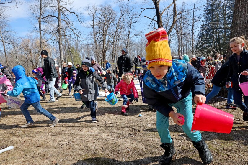 Kids take off at the start of the Lake Shore Easter Egg Hunt at Fritz Loven Park.