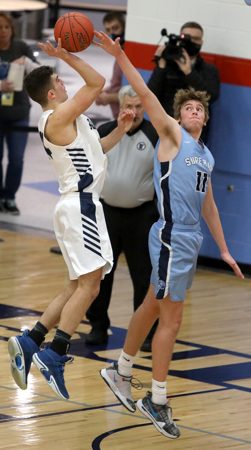 Superior’s Tanner Swanson (11) blocks a shot by Hibbing’s Ayden McDonald (44)