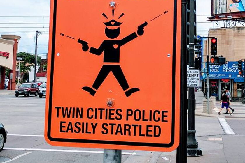 Startle Sign Street signs appear at Twin Cities intersections warning people that ...
