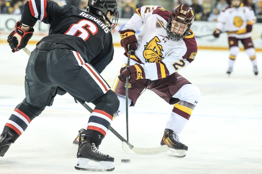 college men play ice hockey