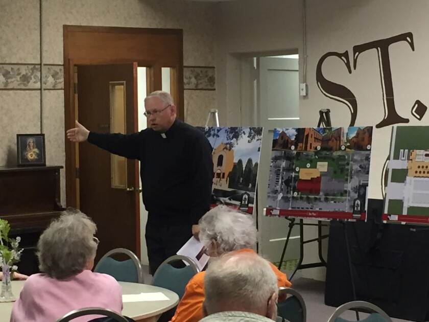 The Rev. Tony Wroblewski explains details of St. Francis of Assisi Catholic Church's expansion plans to parishioners Tuesday. (Spenser Bickett/Brainerd Dispatch)