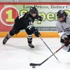 Player skates with puck.