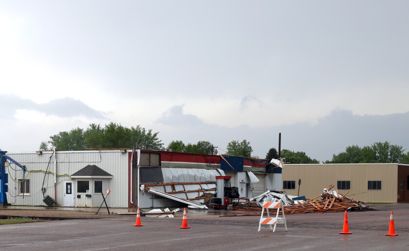 Thompson Ave. S in Rushmore Minnesota blocked off due to severe thunderstorms damage to roofs trees and power lines early Am hours Monday morning.