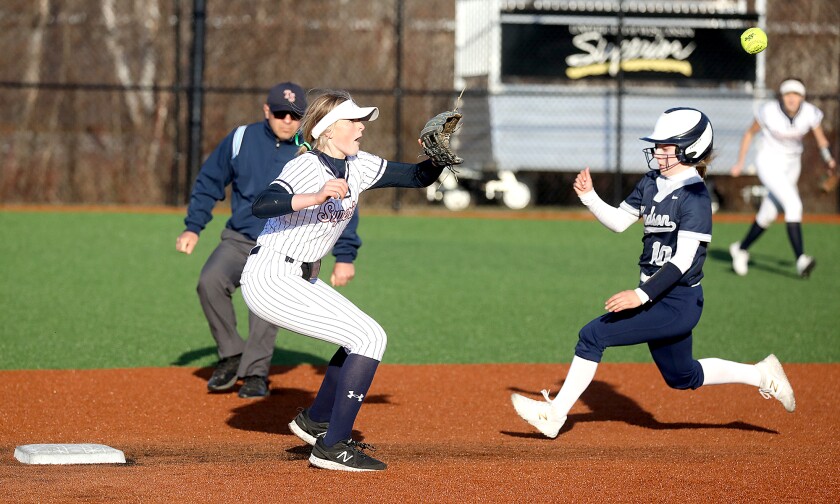 Superior’s Emma Raye (27) makes a play on a ball as Hudson’s Maddie Schwab (10) tries to steal second
