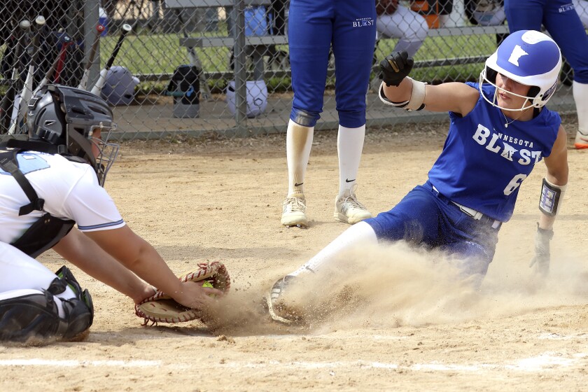 Girl sliding into home.