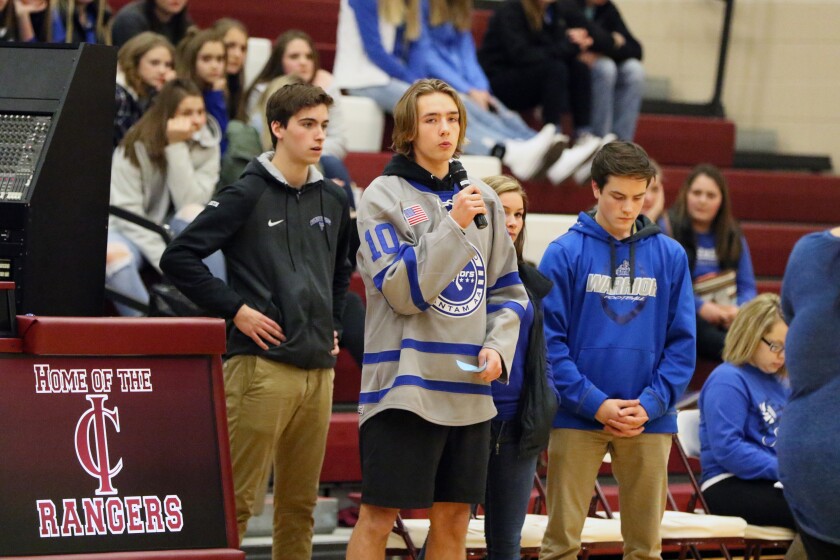 Noah Sundberg, a Brainerd High School junior and organizer of The Lighthouse Project, speaks to Pillager basketball game, where fans wore Warrior blue in support of BHS over recent losses to suicide. Kelly Humphrey / Brainerd Dispatch