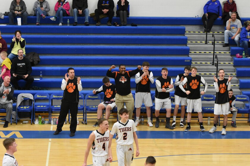 The PR-B bench celebrates a basket by senior Tanner Onken on Thursday, Feb. 14.