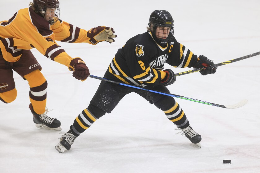 high school boys play hockey