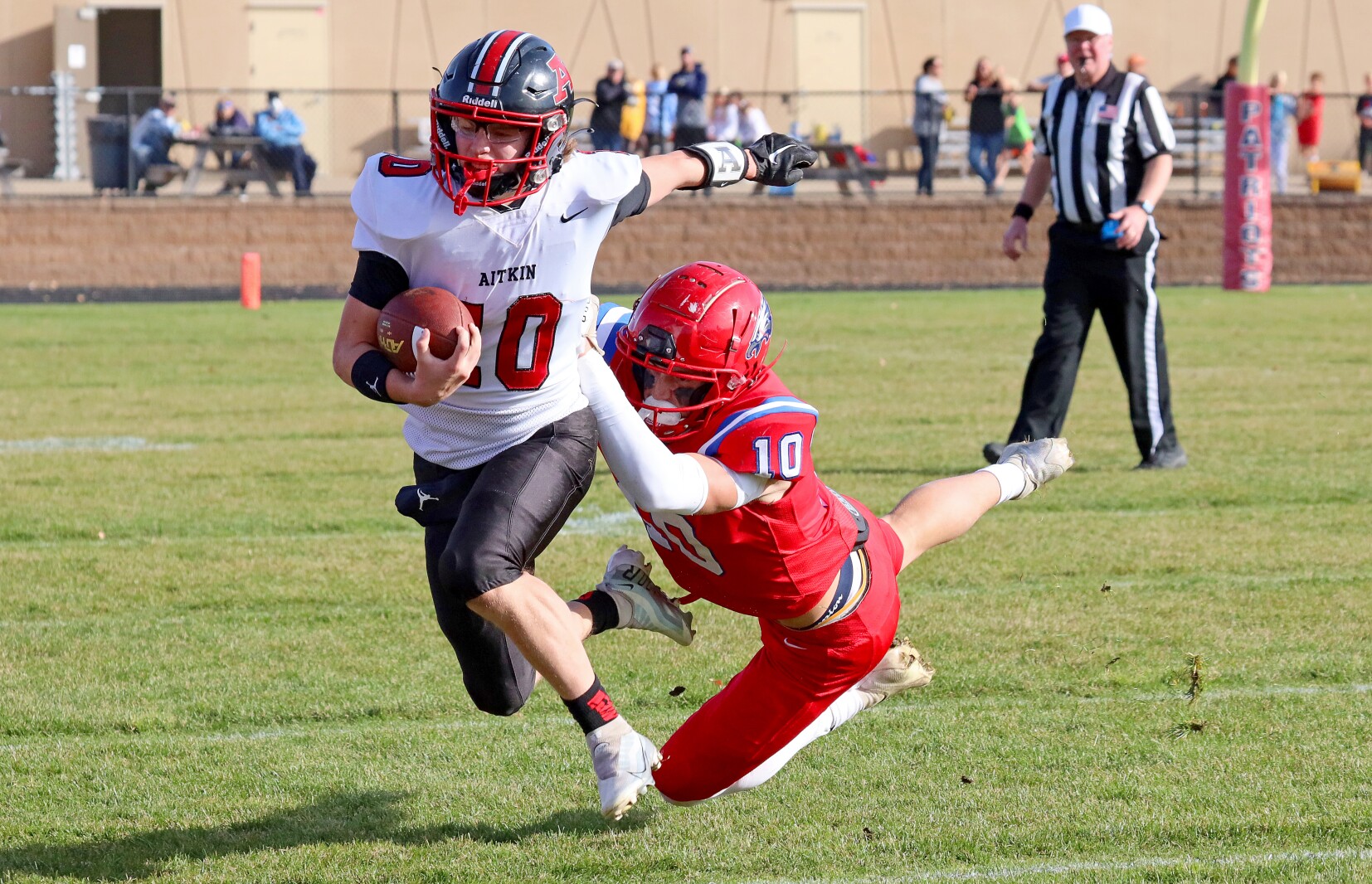 Pequot Lakes' Cullen Kratochvil tackles Aitkin's Braedyn Smith as he runs the ball Saturday, Oct. 29, 2022, at Pequot Lakes.