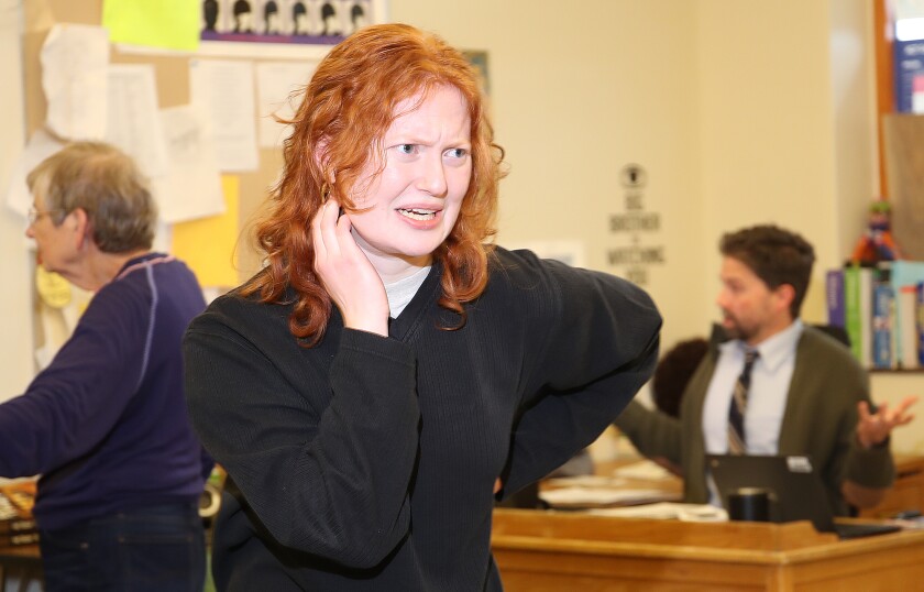 Student performs her forensics piece.