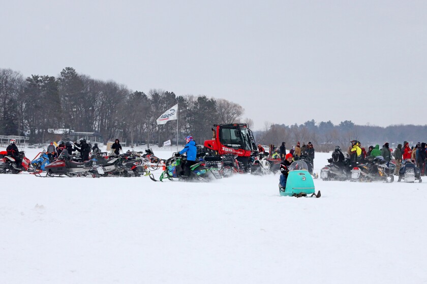 Scorpion snowmobiles and their owners gather on Serpent Lake during the 18th annual Cuyuna Lakes Ice Fishing Contest and Scorpion Homecoming.