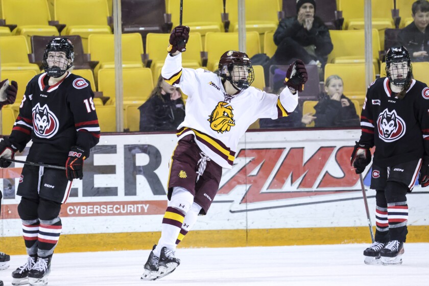 College women play ice hockey
