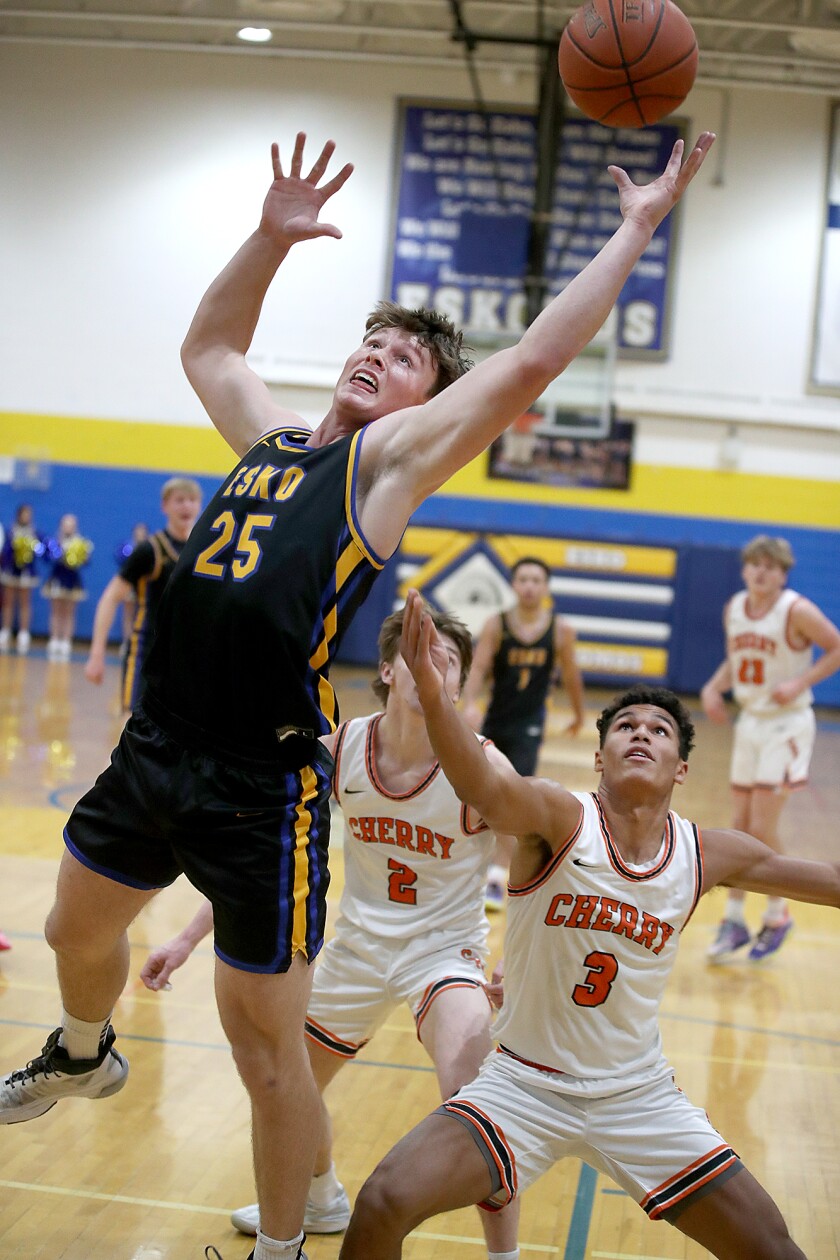 The player grabs the rebound.