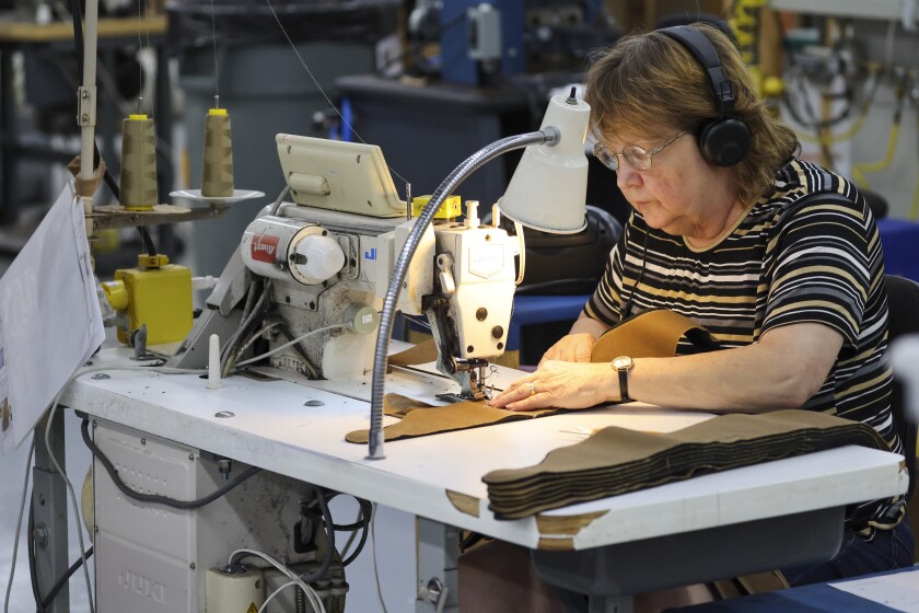 Wool caps with ear bands being made in factory