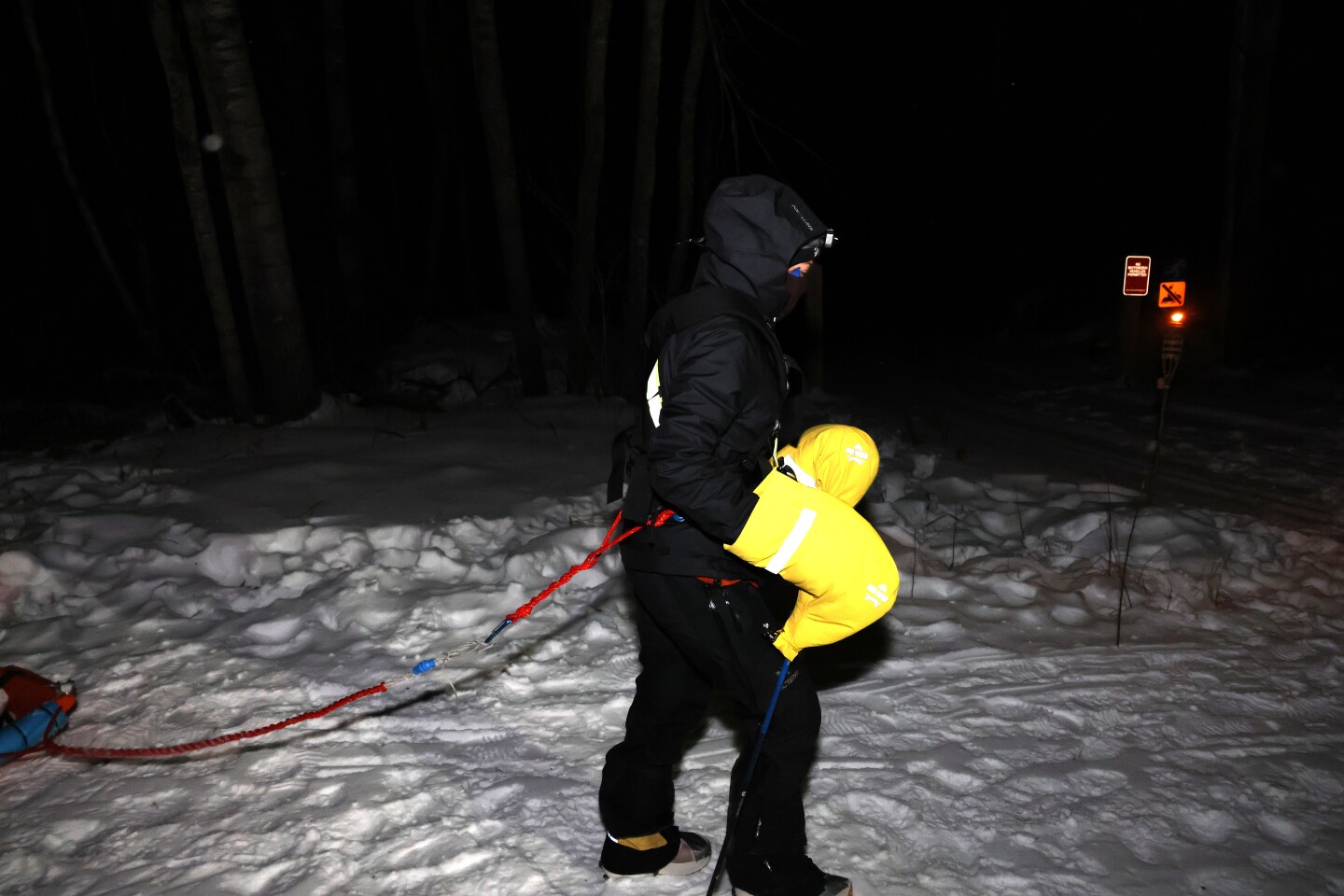Ultramarathoner walks along snowy trail