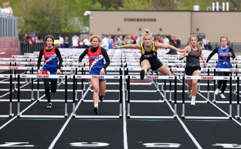 Southwest Minnesota Chrisian Braelyn Kracht clears the last hurdle in the girls 100m race Tuesday afternoon at the Trojan Relays ( from left) Jaelynn Carter, Maddi Langerock, Kracht, Anna Fest, and Larissa Steinhoff.