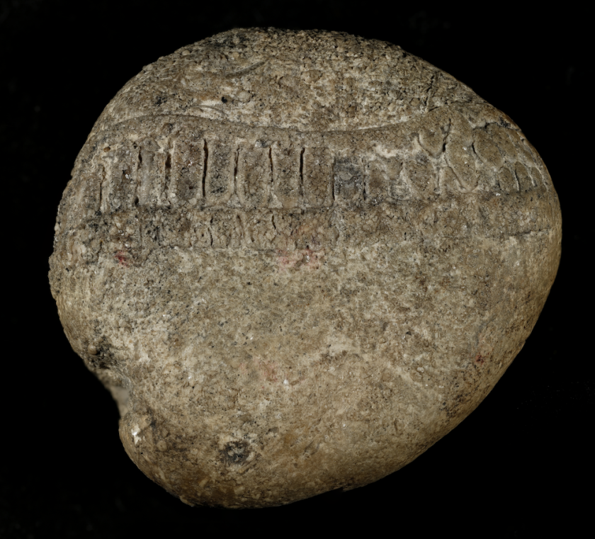 a stone encircled with a ring of markings