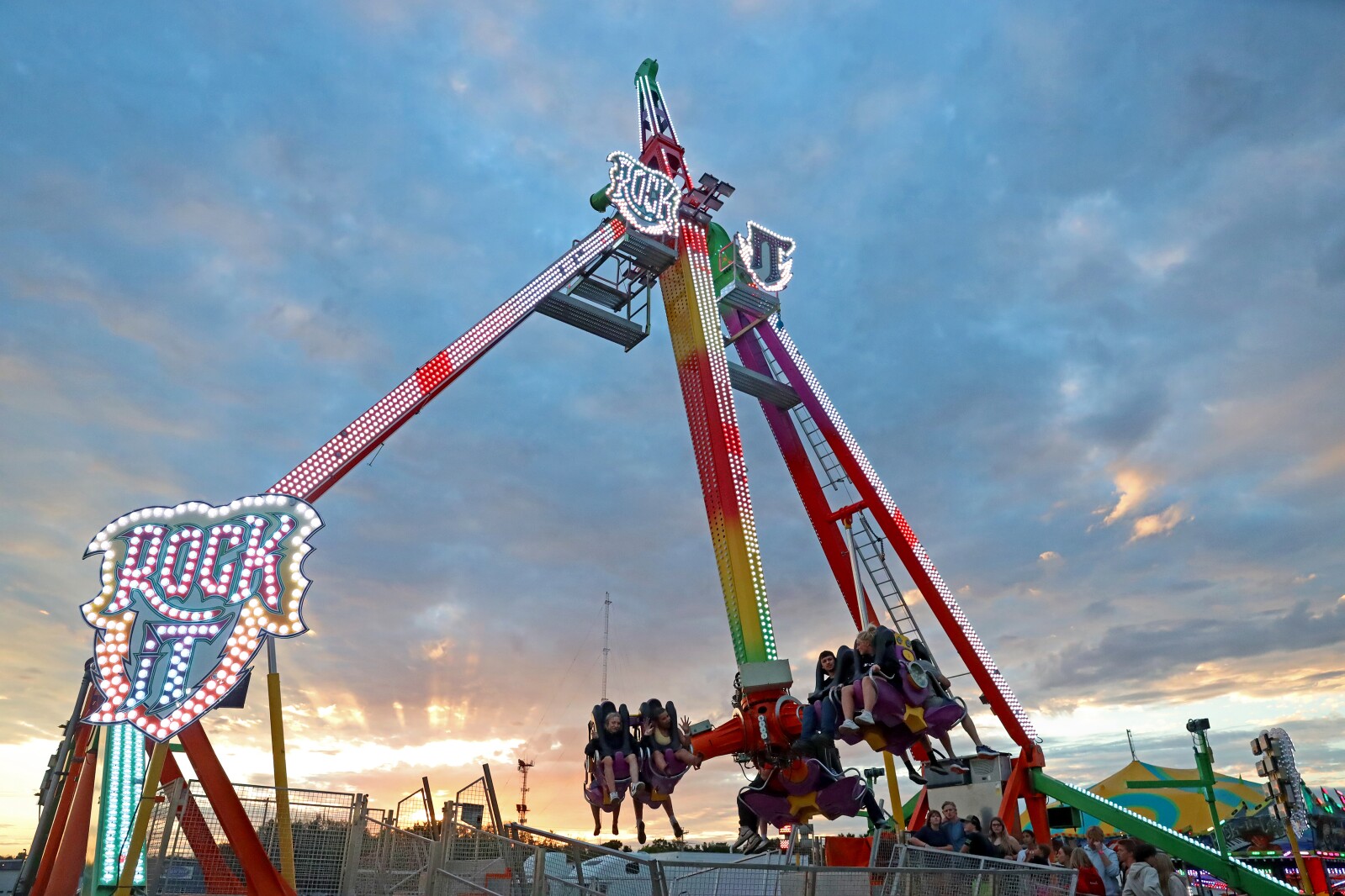 People enjoy the Crow Wing County Fair midway.