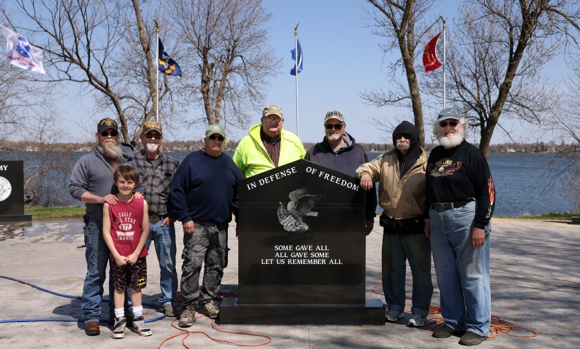 Freedom Veterans Memorial Park cleaned for VFW service day Saturday morning (workers from left) Bryon and Noah Clark, Larry Woodbary, Jon Hait, Larry Commick, Steve Ahlberg, Dale Wilken and Simon Koster.