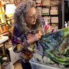 Woman checks dye.
