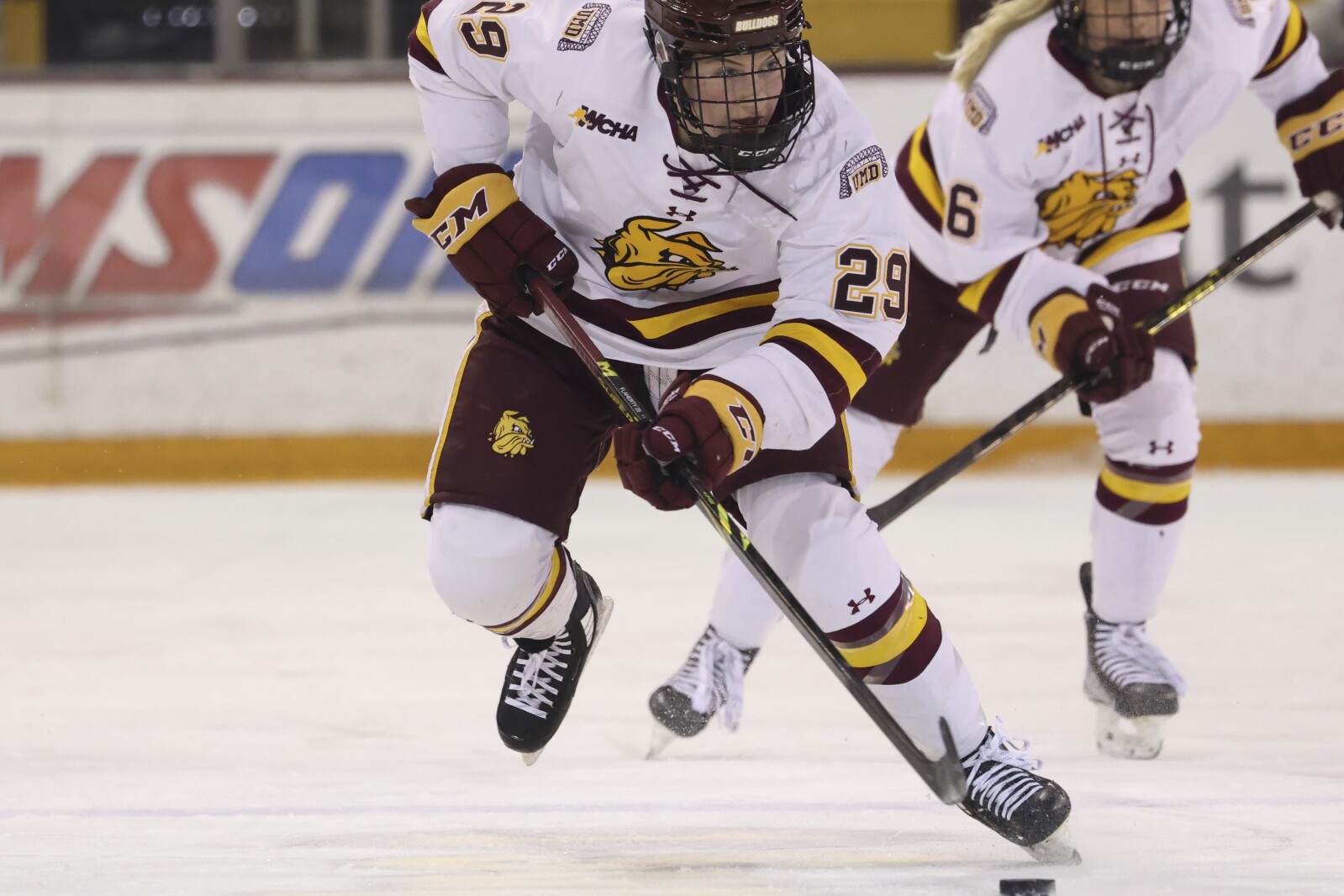 Maggie Flaherty skates with the puck