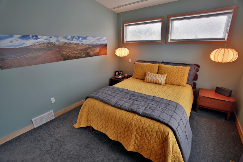 Chris Hemmah bought an empty lot and within five months was living in the new home he designed and built on the site in north Fargo. David Samson / The Forum