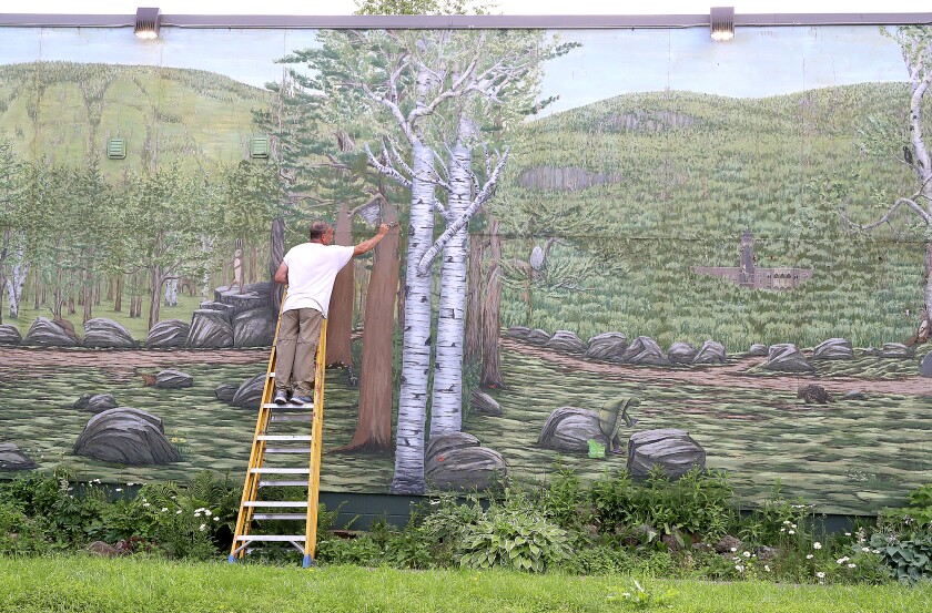 Photos: Artist retouches mural in West Duluth - Duluth News Tribune ...