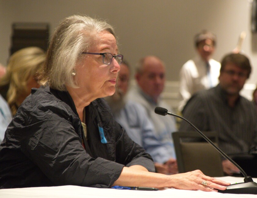 Enbridge Line 3 project director Paul Eberth and attorney Christina Brusven watch as Joel Adams tells an administrative law judge Thursday, Sept. 28, 2017, that he supports a rebuilt oil pipeline in northern Minnesota. Don Davis / Forum News Service