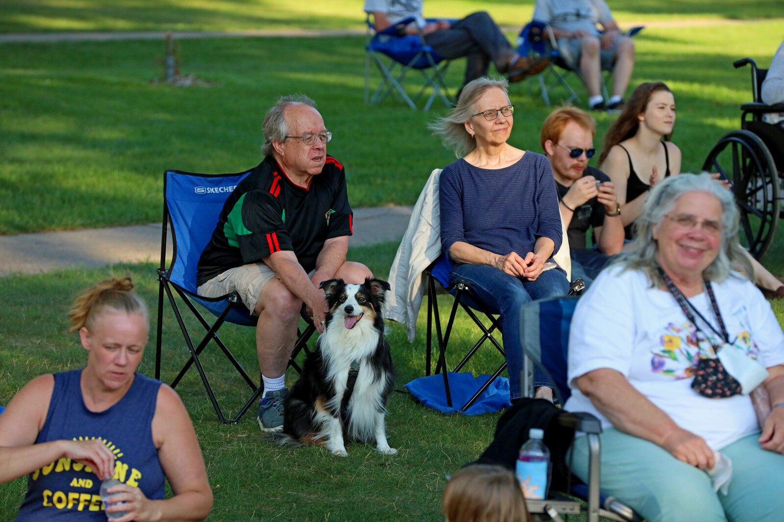 People enjoy a concert in the park