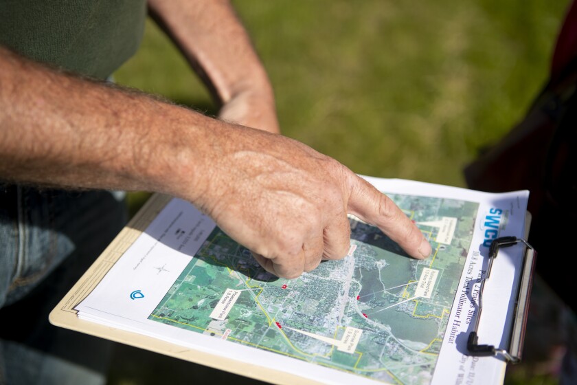 Ryan Peterson with the Kandiyohi County Soil and Water Conservation District identifies areas on a map of the City of Willmar that will become areas of prairie restoration on Thursday, June 16, 2022.