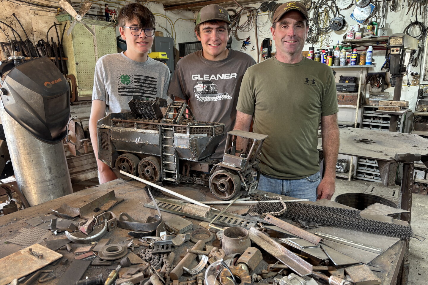 There is always a project waiting in their shop on the farm for Pat Amberg and his sons. From left, Landon, Jason and Pat are shown with their latest project in the works in their shop on June 4, 2026.