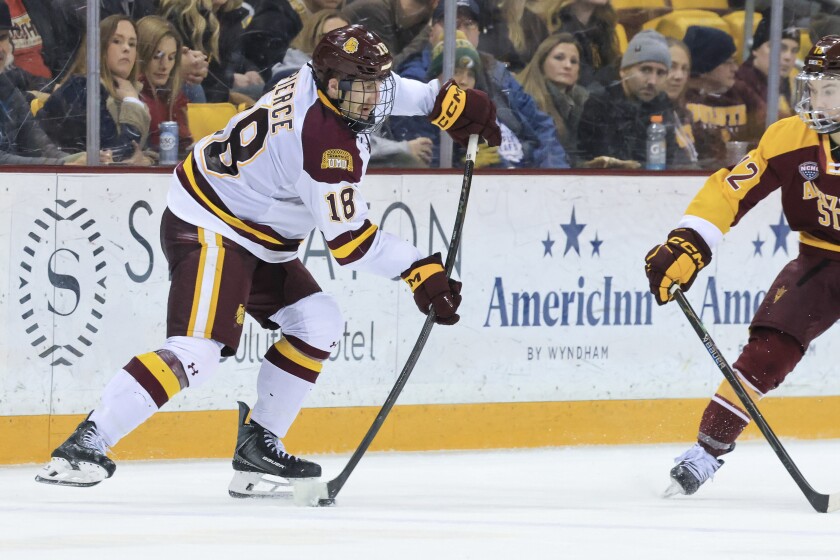college men play ice hockey