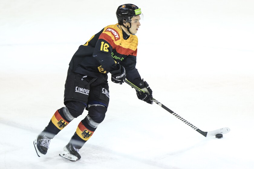men play ice hockey
