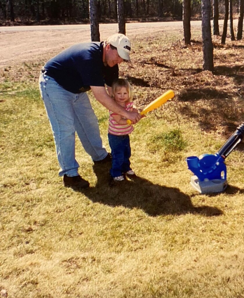 Paul Vaara helps his daughter, Zoey Vaara, with her swing