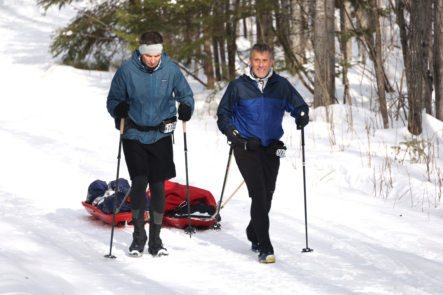 Ultramarathoners hike along trail