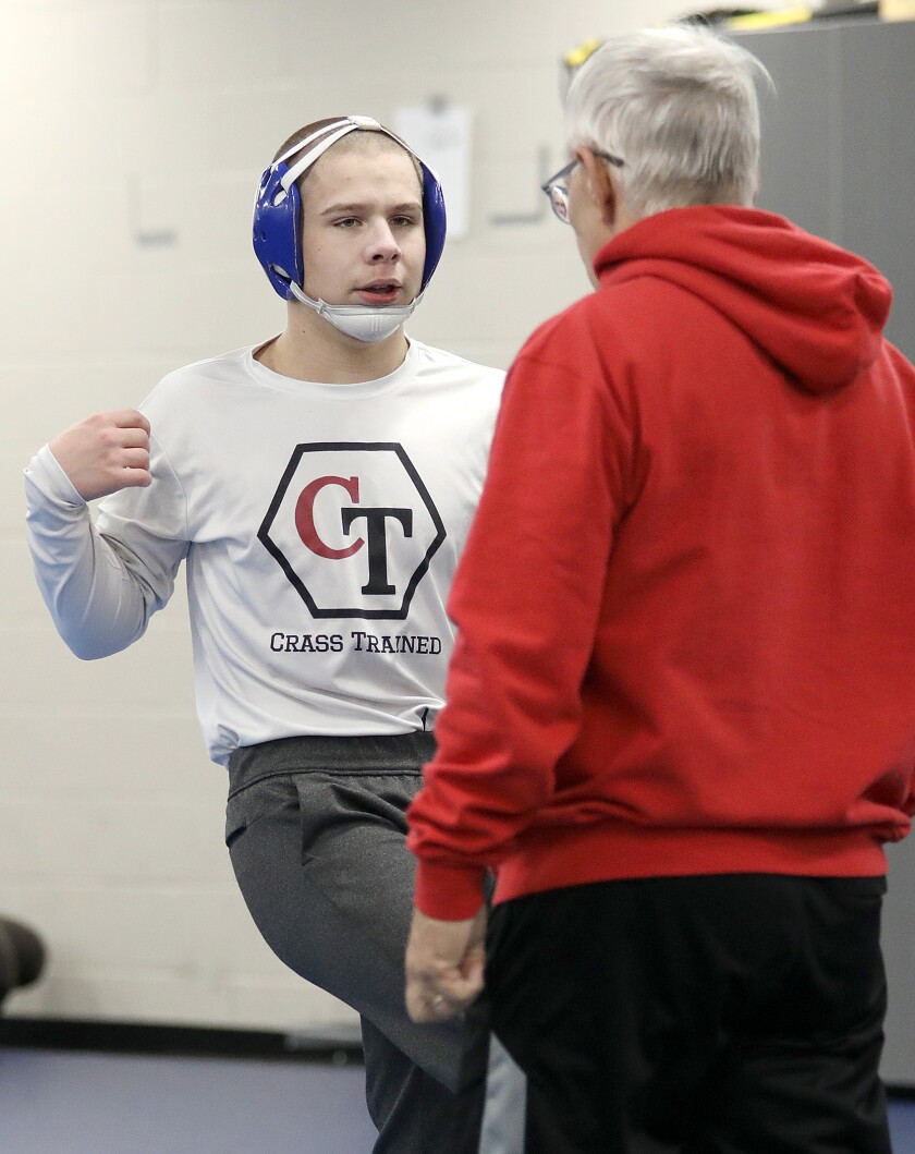 Superior’s Connor Krueger, left, talks to his head coach Bob Coleman