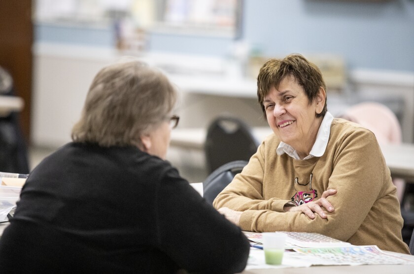 Melanie Lady, right, laughs while chatting with her friend Marsha Milani at the Little Art Gallery Creation Gathering at the Willmar Community Center on Tuesday, April 12, 2022.