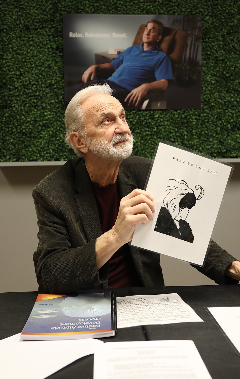 Lyle Wildes holding a visual interpretation test