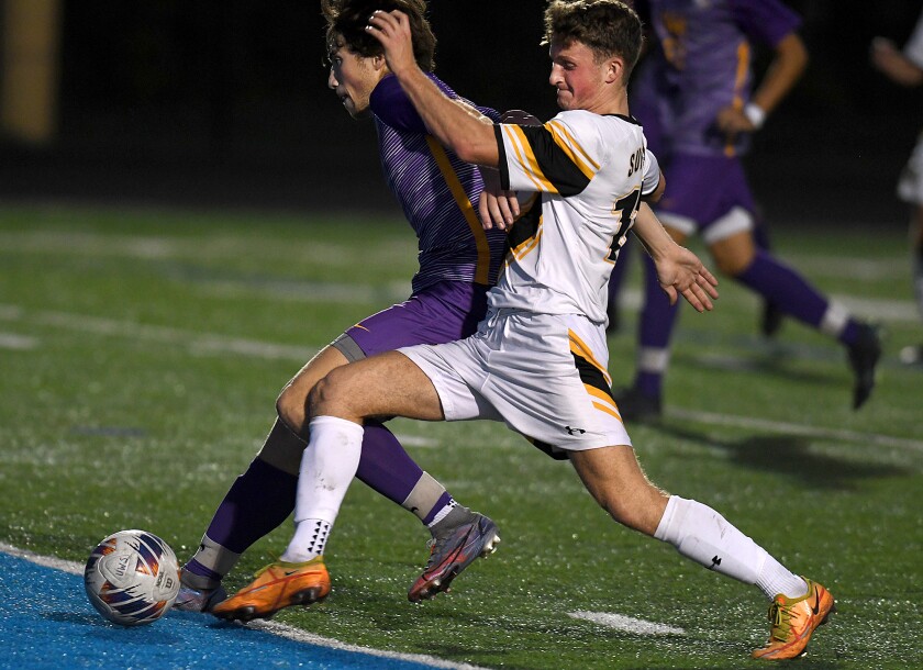 UW-Superior’s Mackie Ringrose (10) gets around Northwestern’s Tim DeLoye (4) on his way to scoring a goal