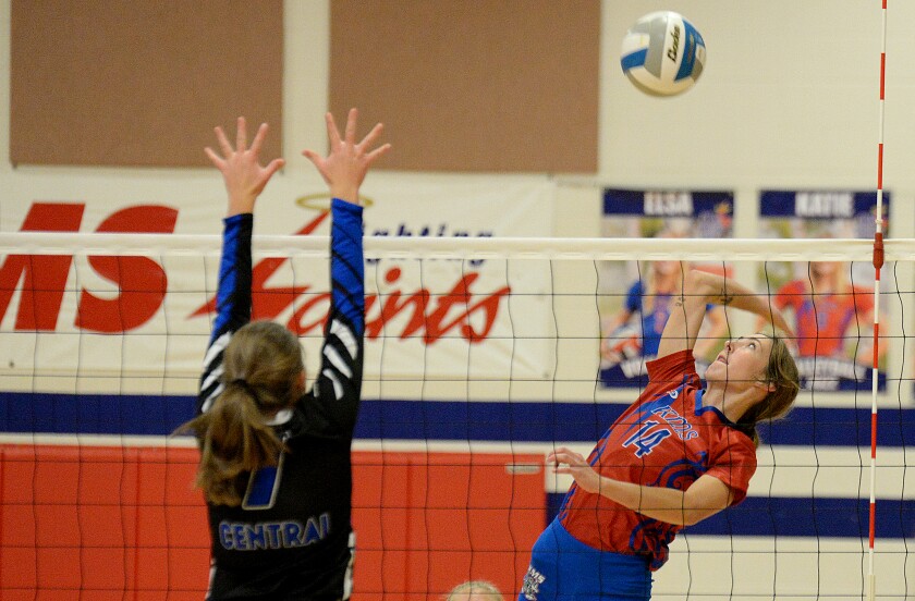 KMS senior Shakira Olson, 14, goes up for an attack against CMCS' Hannah Graves during a Camden Conference match on Thursday, Sept. 29, 2022 in Kerkhoven.