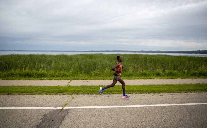 Top male finisher Nadir Yusuf cruises along the shore of Green Lake while running in the Green Lake Road Race in Spicer on the morning of Sunday, June 3, 2022. Yusuf finished the race in a time of 1 hour, 2 minutes and 36 seconds.