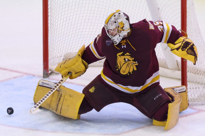 college men play ice hockey