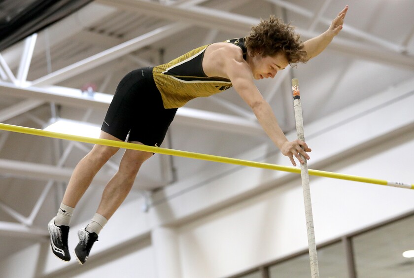 Northwestern’s Cam Benesch clears the bar