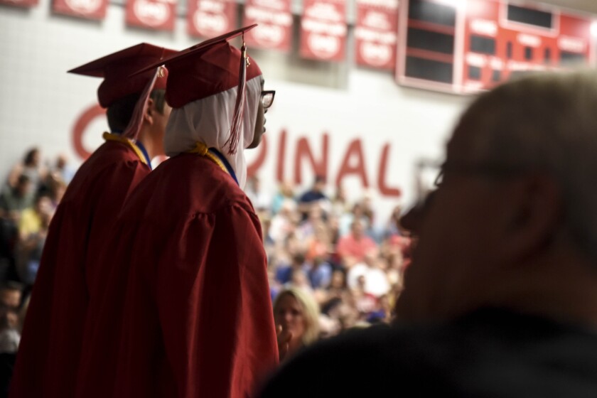 Erica Dischino / TribuneStudents walk in the procession as the audience watches during the Class of 2019 commencement ceremony Sunday at Willmar Senior High School.