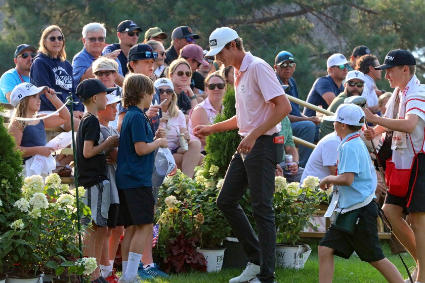 Bryce Lewis autographs hats, balls and everything else he was handed following the final round on Sunday, Sept. 1, 2024, of the CRMC Championship presented by Gertens at Cragun's Legacy Courses.