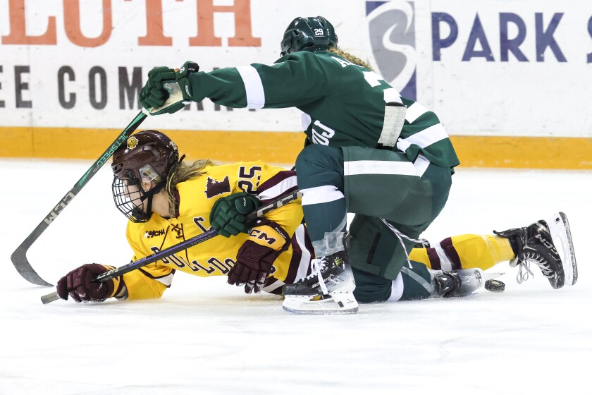 college women play hockey