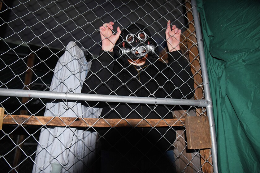 Briana Sanchez / TribuneAndrew Oelfke waits to scare people in the Deegers Freak Show haunted house Sunday night. The haunted house was put on by the Willmar Noon and Nite Lions. Regular admission is $10. Admission is $8 with the donnation of a canned food item for the Willmar Area Food Shelf.