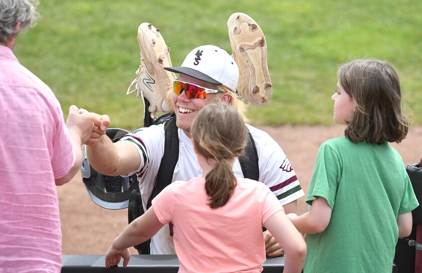 Player talks with crowd after game.