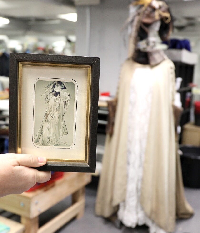 Lisa Blade holds a sketch of the costume worn by Angela Lansbury on Broadway