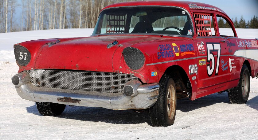 A red 1957 Chevrolet car.